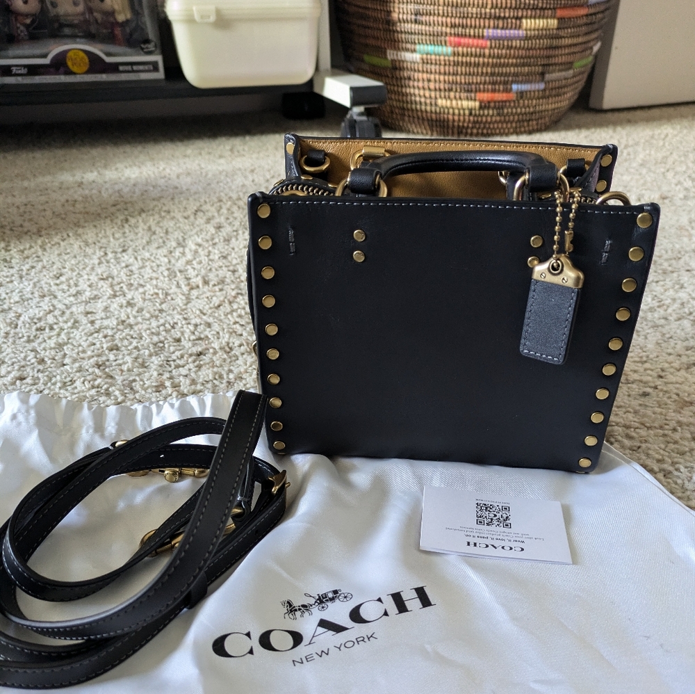 NWOT - Coach Rogue 17 with brass rivets